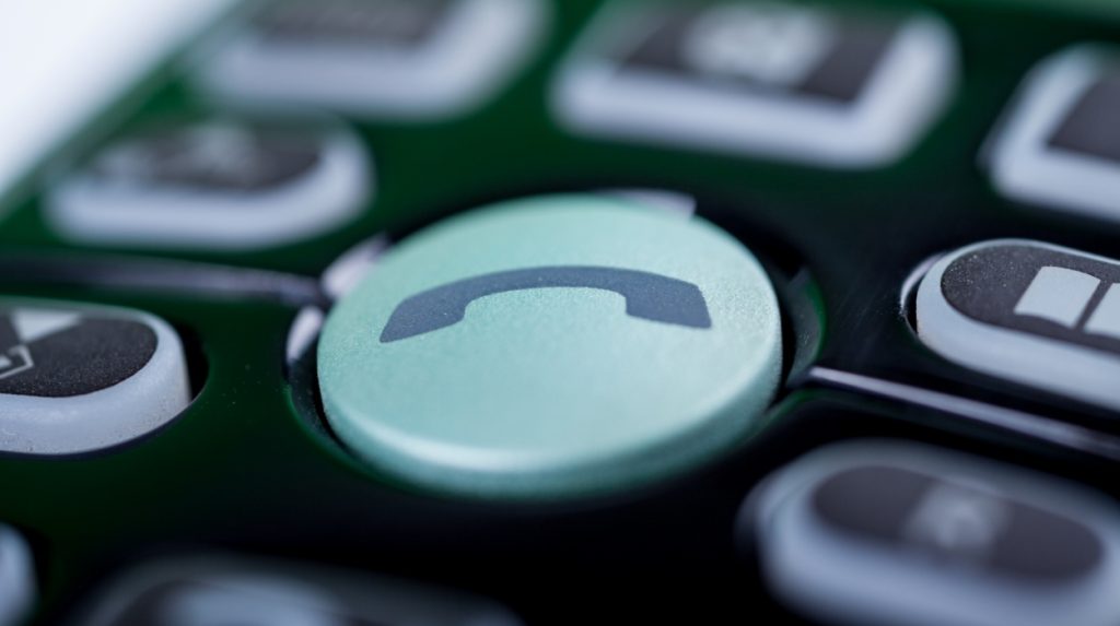 Teal-colored phone button on a mobile device